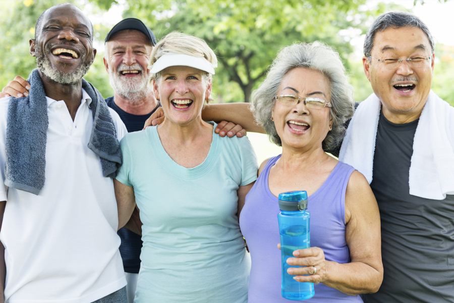 a diverse group of seniors looking to celebrate the community at The Carrington