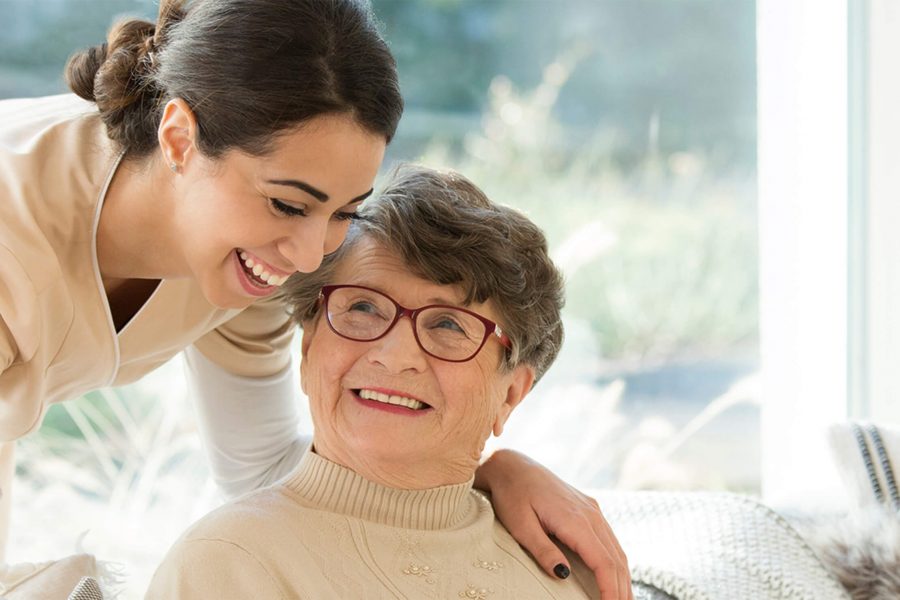 a photo of a resident receiving memory care at The Carrington