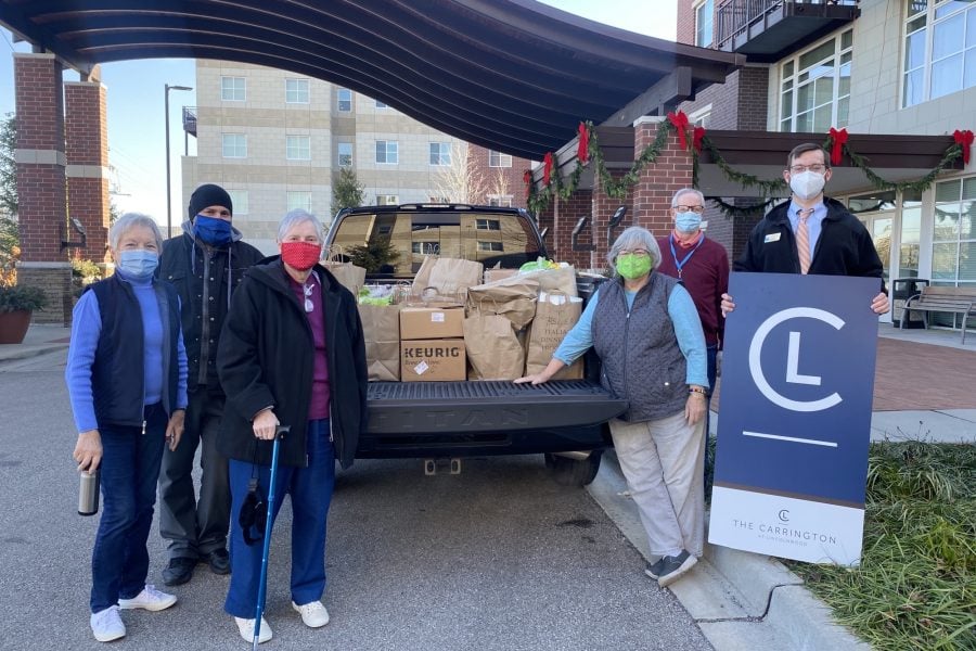 photo of volunteers from The Carrington at Lincolnwood giving back during the holidays