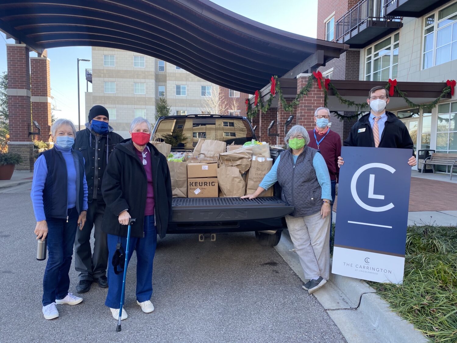 photo of volunteers from The Carrington at Lincolnwood giving back during the holidays