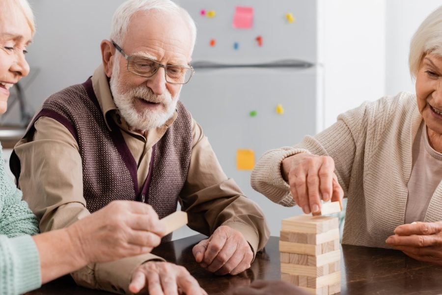 senior citizens playing Jenga